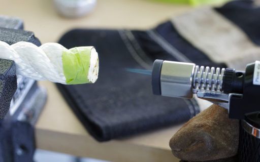 Fusing the cut ends of the rope with a butane torch