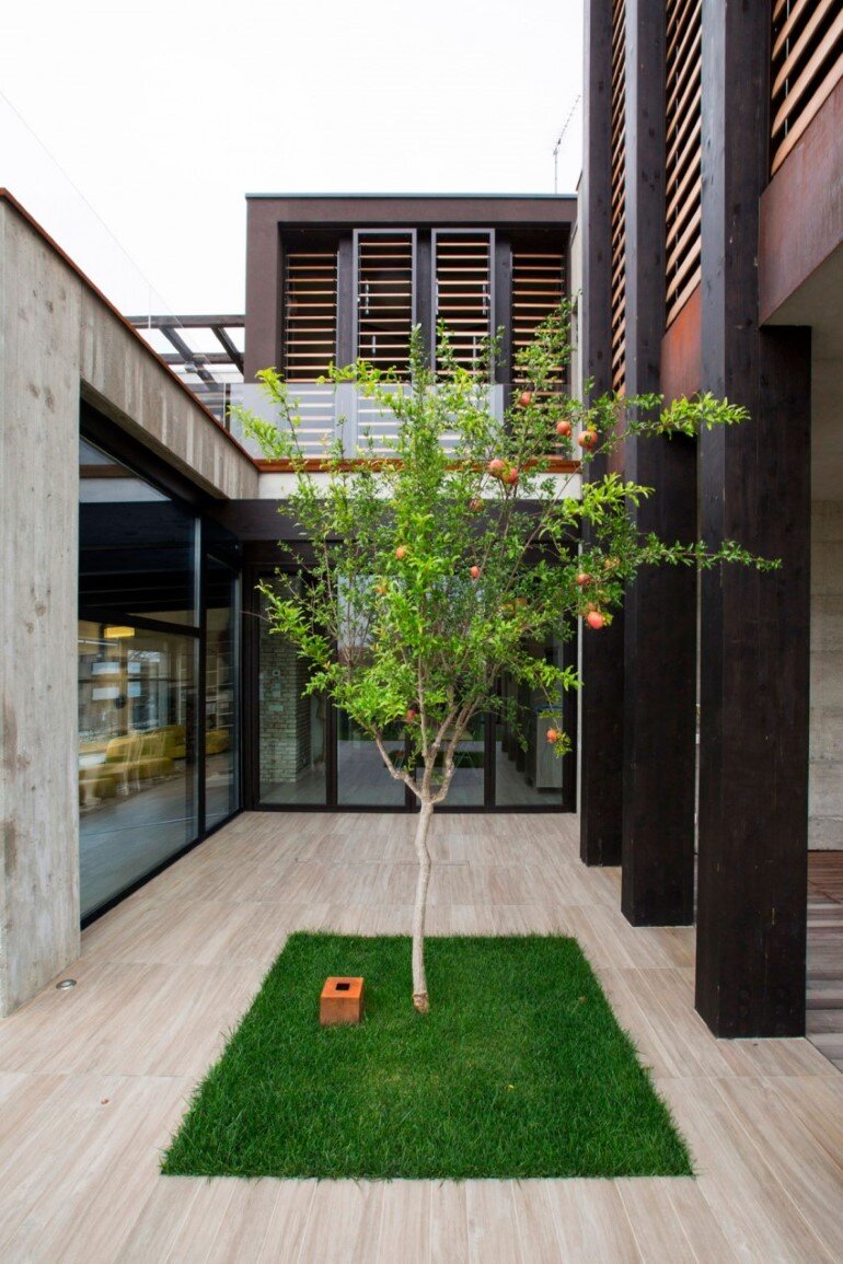 Modern Concrete Block House with Wooden Patio Attached (3)