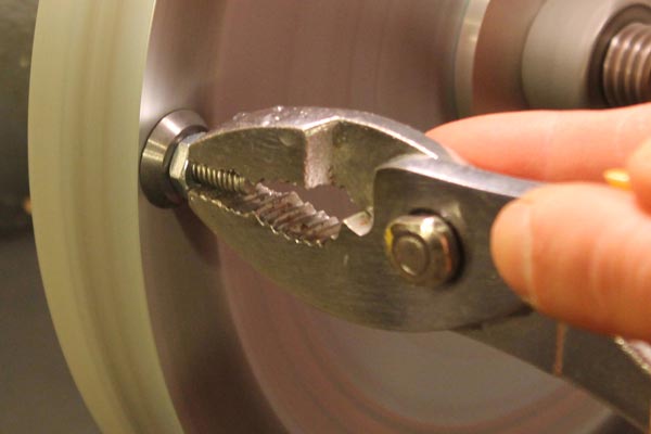 Sharpening a replaceable carbide cutter.