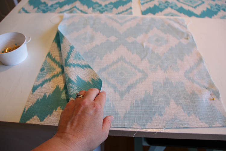 Pinning the fabric squares together.
