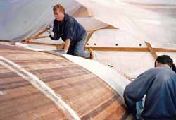 sheathing a cedar strip sailboat hull with woven rovings and epoxy