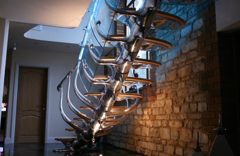 Sculptural staircase with glass and timber details
